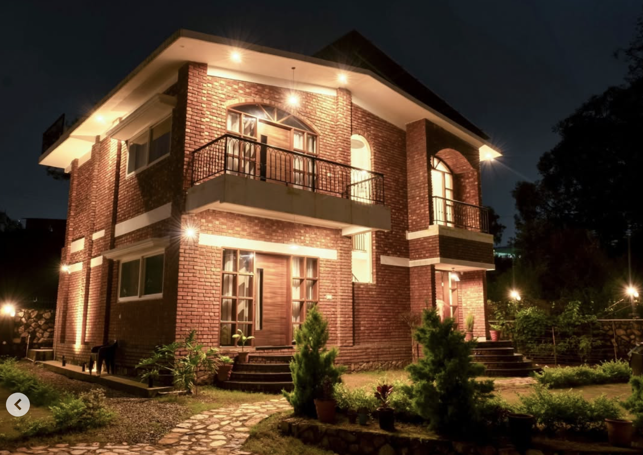Sun-lit interior living space at The Abode Living luxury villa Dehradun